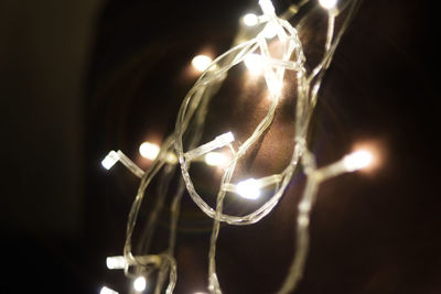 Low angle view of illuminated light bulb