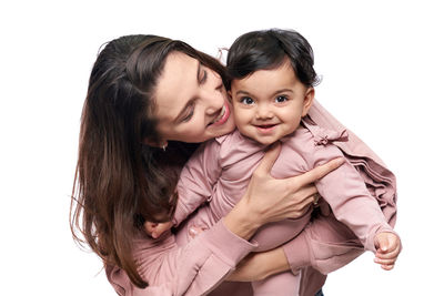 Portrait of happy friends against white background