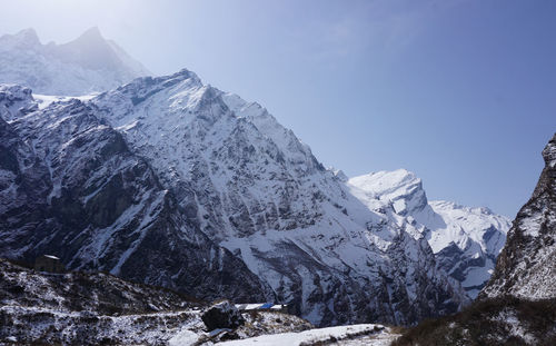 Scenic view of snowcapped mountains against sky