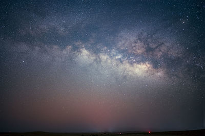 Scenic view of star field against sky at night