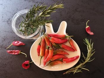 Close-up of red chili peppers on table