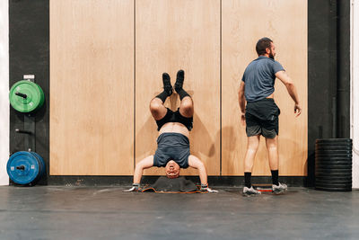 Men exercising in gym