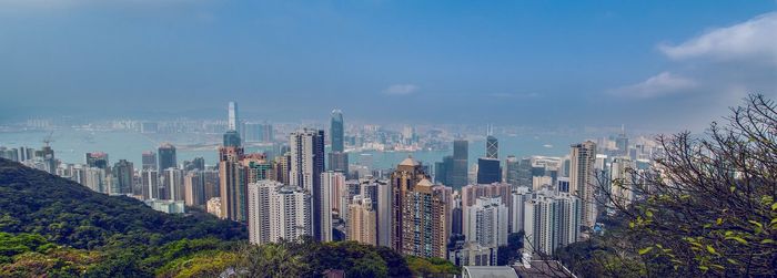 Panoramic view of modern buildings against sky in city