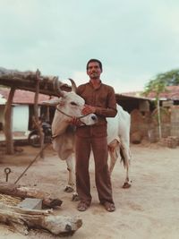 Portrait of smiling young man standing outdoors