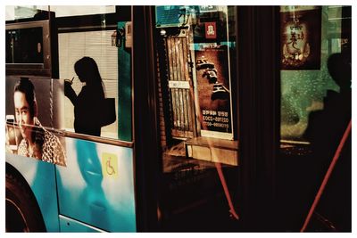 Reflection of people on glass window