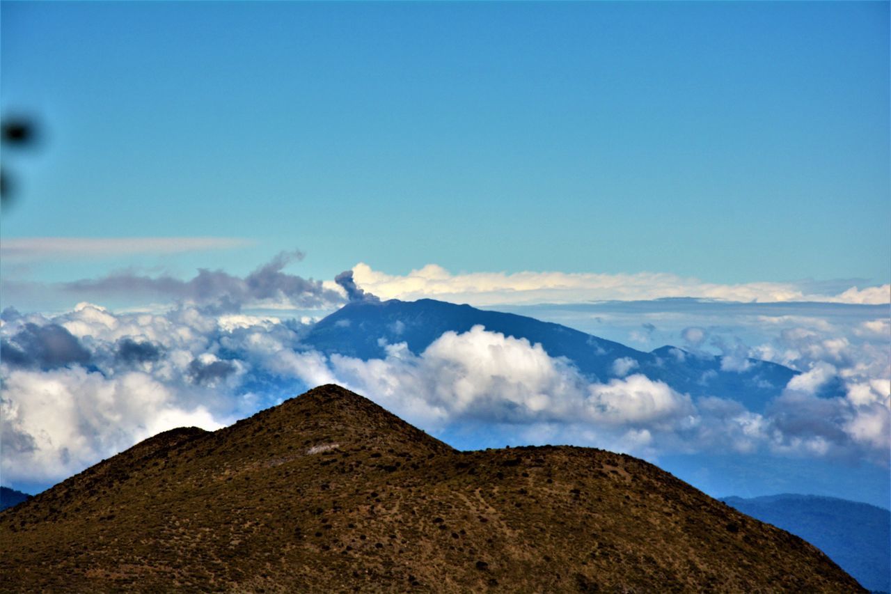 blue, sky, mountain, cloud - sky, mountain range, beauty in nature, scenics, tranquility, travel destinations, outdoors, nature, landscape, mountain peak, no people, day