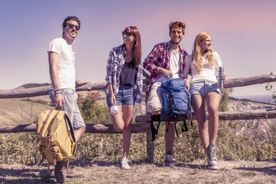 Group of young hikers in the mountains preparing an excursion