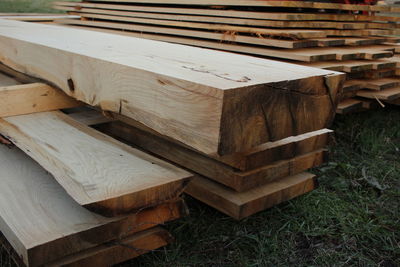 Close-up of old wooden logs on field