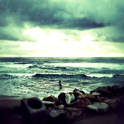 Scenic view of sea against cloudy sky