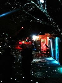 View of illuminated people at night