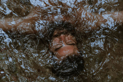 Portrait of woman swimming in water