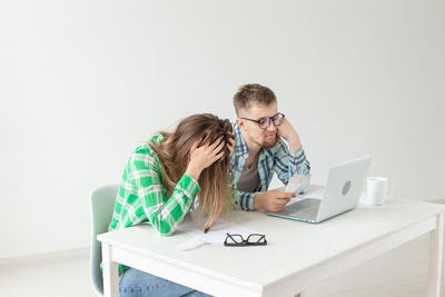 Young man using laptop on table