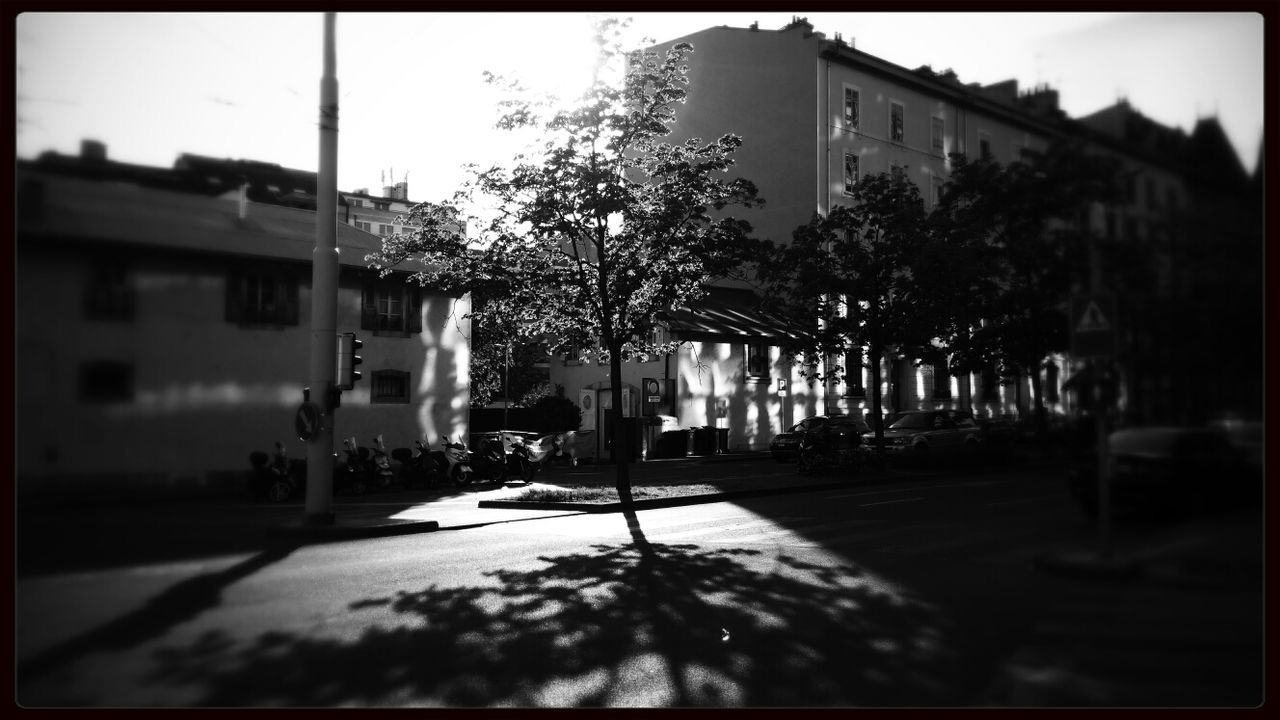 building exterior, architecture, built structure, transfer print, street, residential structure, residential building, city, house, auto post production filter, building, the way forward, road, tree, sunlight, transportation, sky, car, outdoors, empty