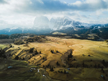 Scenic view of landscape and mountains against sky