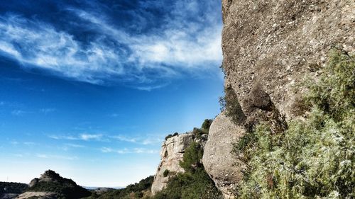 Low angle view of rock formation against sky