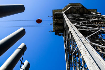 Low angle view of building against clear blue sky