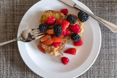 High angle view of french toast and berries on plate