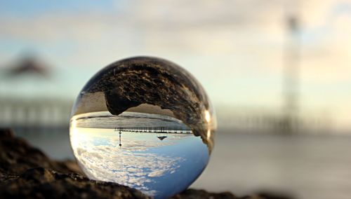 Close-up of crystal ball against blurred background