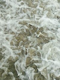 Full frame shot of surf on beach