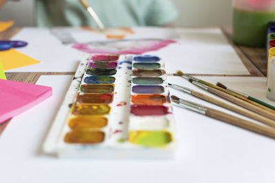 High angle view of paintbrushes on table