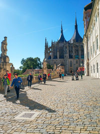 Group of people in front of historic building