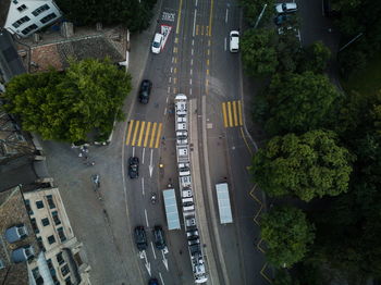 High angle view of a tram stop and cars on  road in zürich city