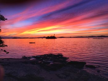 Scenic view of sea against orange sky