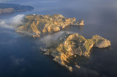 Aerial view of the medes islands in a foggy sunrise over the costa brava coast and mediterrania sea