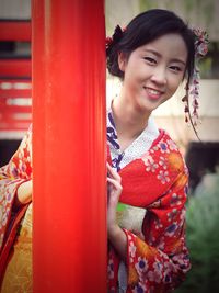 Portrait of smiling girl standing outdoors