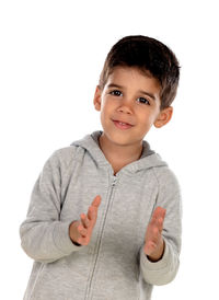 Portrait of boy standing against white background