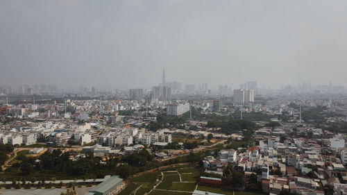 High angle view of buildings in city against sky