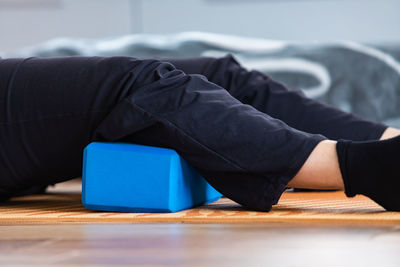 Close-up of man lying down on table