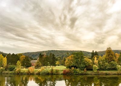 Scenic view of lake and mountains against sky