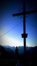 Low angle view of silhouette mountains against sky