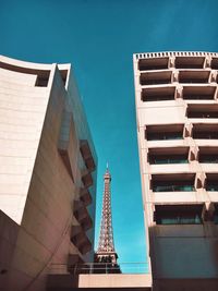 Low angle view of buildings against blue sky