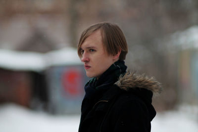 Thoughtful man looking away during winter