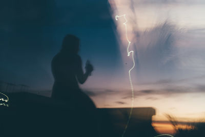 Close-up of woman against sky