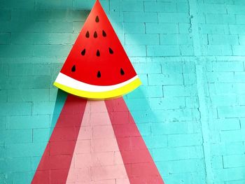 Close-up of multi colored umbrella on wall