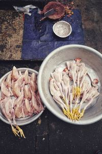 Two bowls full of dead chicken, killed birds ready to eat. on the streets of yangon, myanmar.