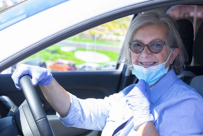 Portrait of woman sitting in car