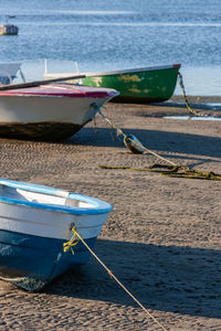 Boat moored on sea shore