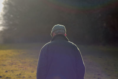 Rear view of man against sky