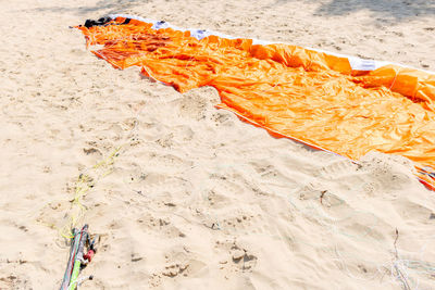 High angle view of orange surf leaf on beach