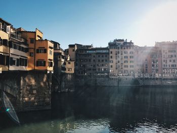 Buildings in city against clear sky