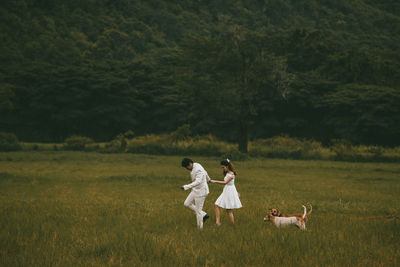 Couple kissing on field