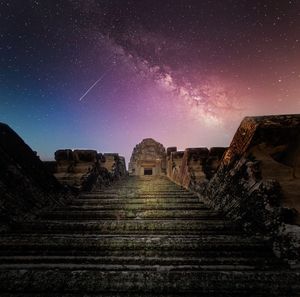 Old ruins against sky at night