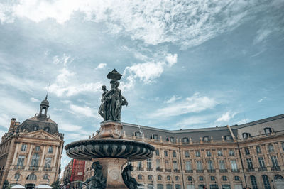 Low angle view of statue against building