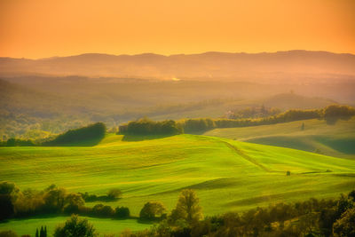 Scenic view of landscape against sky during sunset