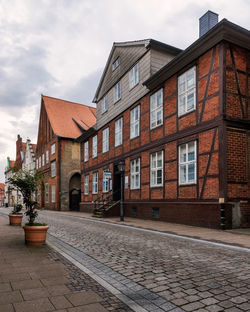 Buildings in lüneburg against sky