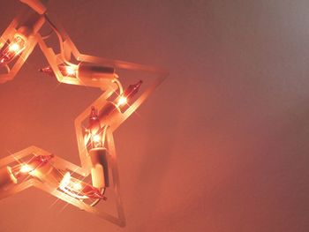 Low angle view of illuminated light bulb